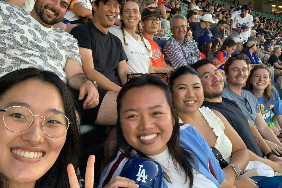 group of people attending a baseball game