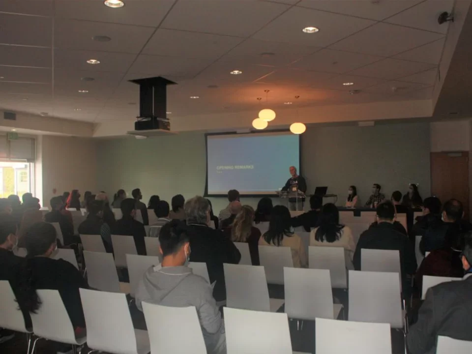 Department chair standing at the podium addressing the retreat guests