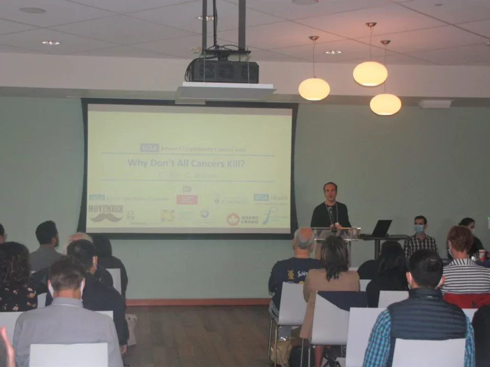 Faculty member presenting research during department retreat