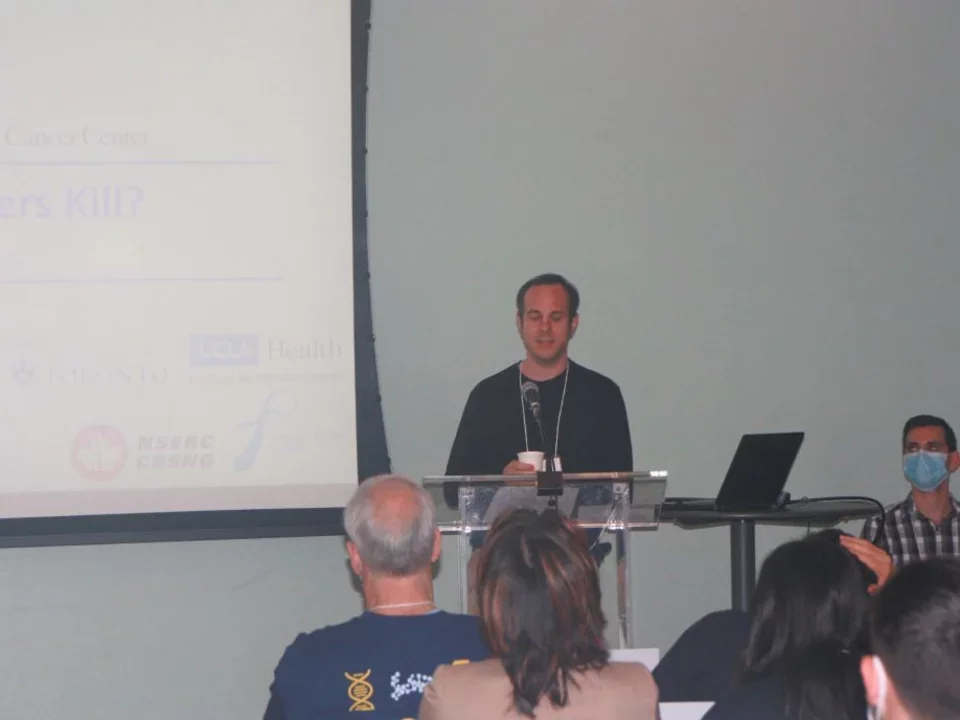 Faculty member presenting research during department retreat