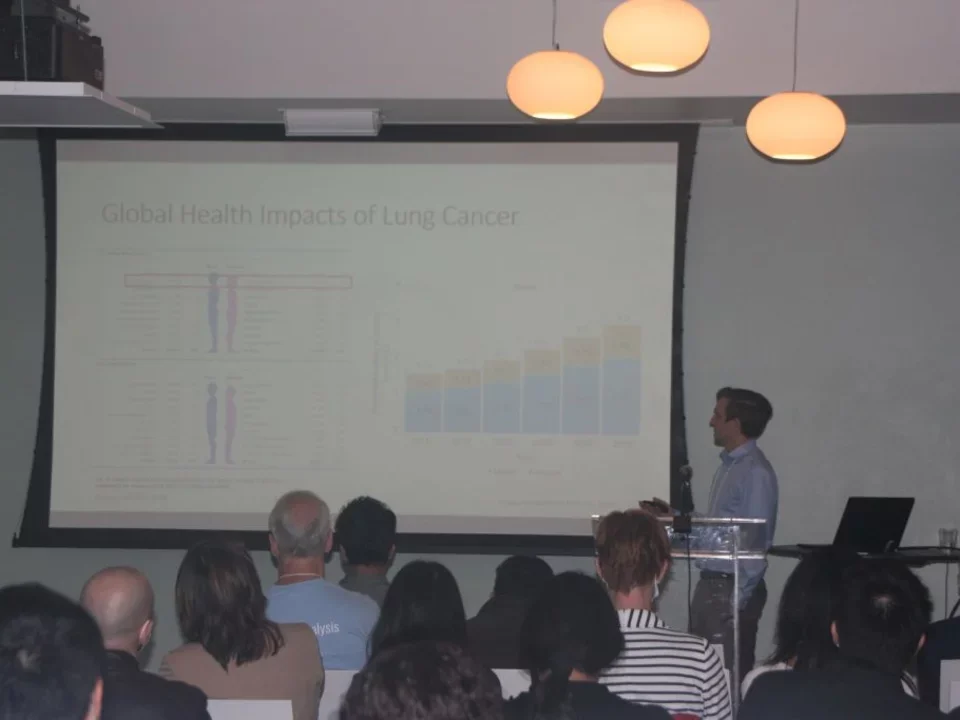 Graduate student presenting research to department
