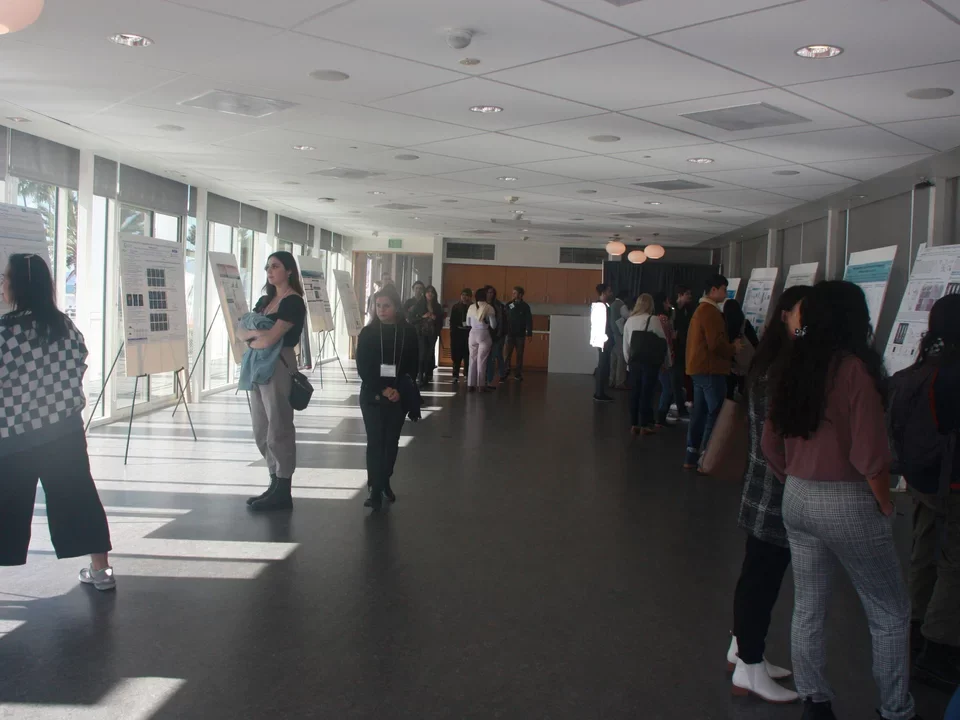 guests at retreat looking at scientific posters