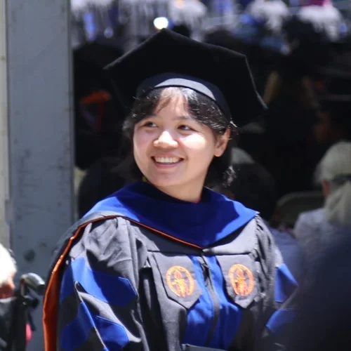 woman in graduation cap and gown