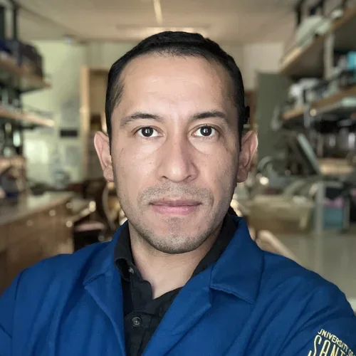 male in blue lab coat