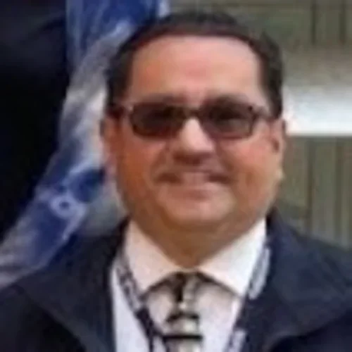 Photo of man wearing sunglasses and a necktie
