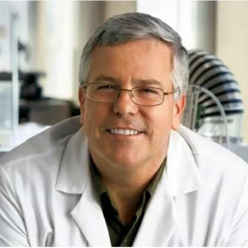 man with glasses wearing a white lab coat