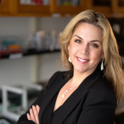woman with long blonde hair and black top