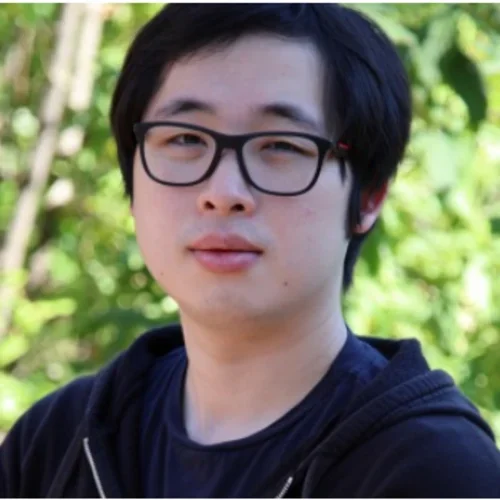 person with glasses and black sweatshirt