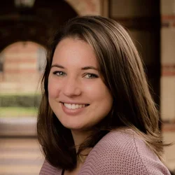 female with pink sweater and brown hair
