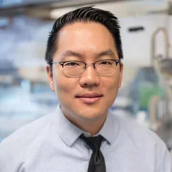 Male in a light shirt and dark tie