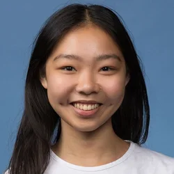 female in white shirt with dark hair