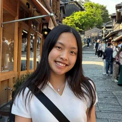 female with dark hair, white shirt