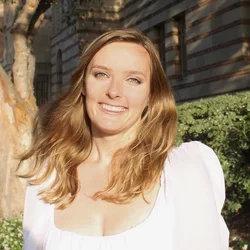 Female in white top smiling