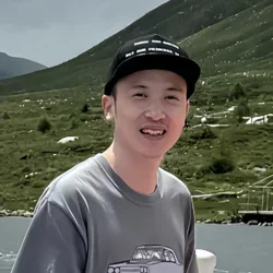 man wearing black baseball hat and grey t-shirt