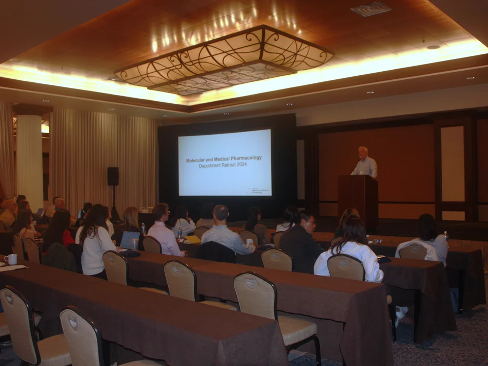 department chair welcoming guests to retreat